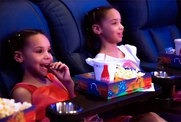 Two Children in Reclined Seats with Concessions Items